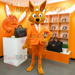 Orange Roe Deer mascot costume character dressed with a Suit and Clutch bags