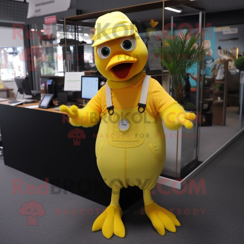 Yellow Pigeon mascot costume character dressed with a Dungarees and Gloves Yellow Pigeon mascot costume character dressed with a Dungarees and Gloves