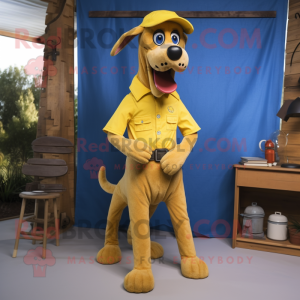 Yellow Dog mascot costume character dressed with a Chambray Shirt and Belts