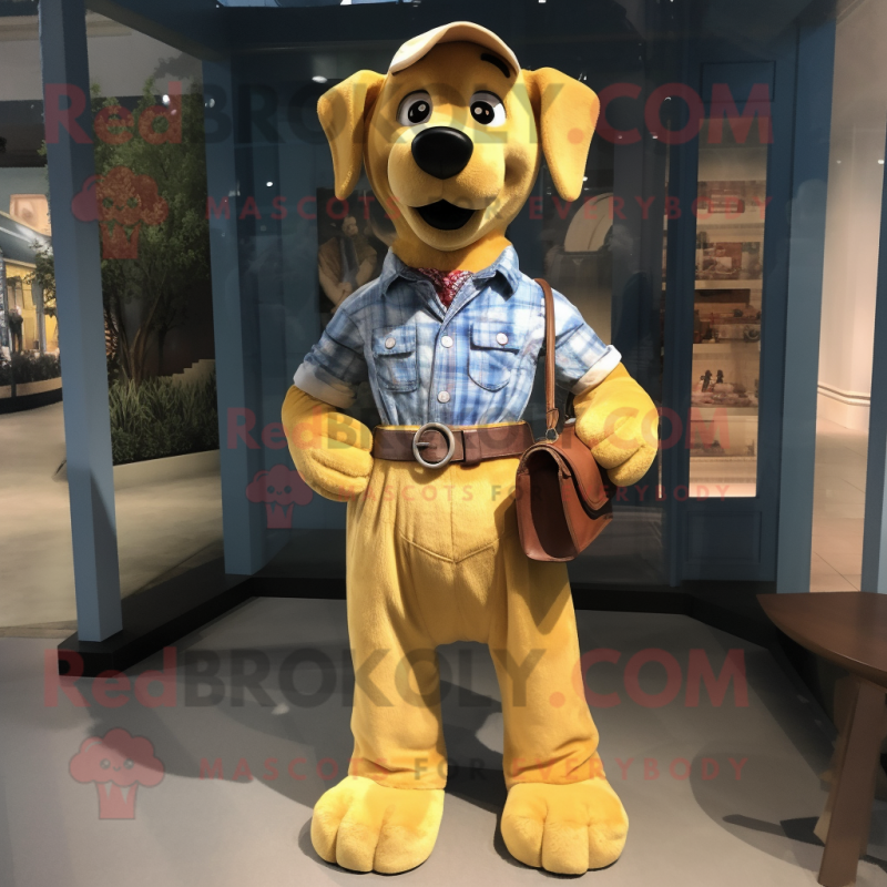 Yellow Dog mascot costume character dressed with a Chambray Shirt and Belts