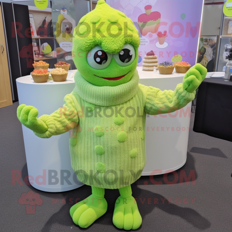 Lime Green Cupcake mascot costume character dressed with a Cardigan and Mittens