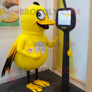Yellow Blackbird mascot costume character dressed with a One-Piece Swimsuit and Digital watches