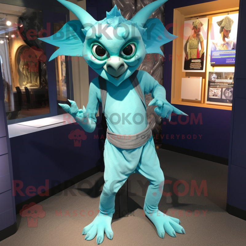 Cyan Gargoyle mascot costume character dressed with a Playsuit and Cummerbunds Cyan Gargoyle mascot costume character dressed with a Playsuit and Cummerbunds