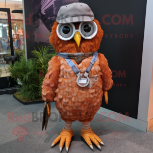 Rust Owl mascot costume character dressed with a Henley Shirt and Eyeglasses