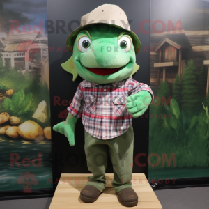 Green Goldfish mascot costume character dressed with a Flannel Shirt and Caps