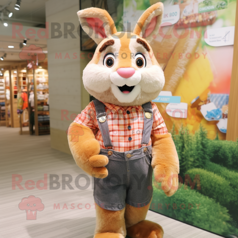 Peach Wild Rabbit mascot costume character dressed with a Flannel Shirt and Rings