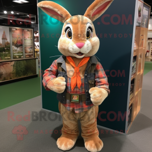 Peach Wild Rabbit mascot costume character dressed with a Flannel Shirt and Rings
