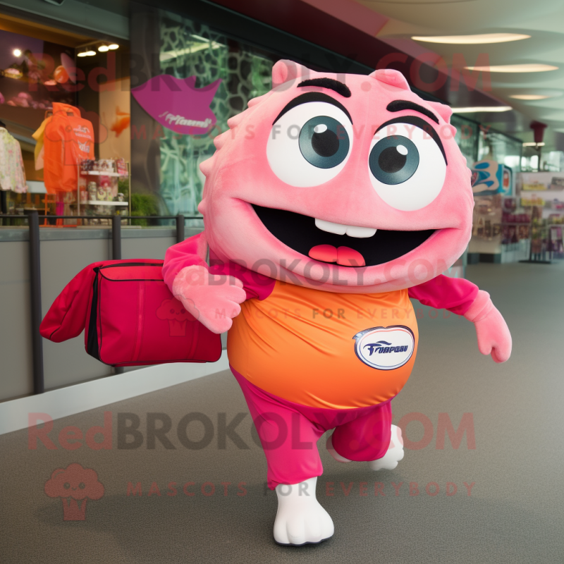 Pink Salmon mascot costume character dressed with a Running Shorts and Tote bags