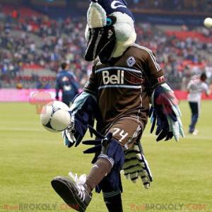 Blue white and black bird mascot in brown outfit -