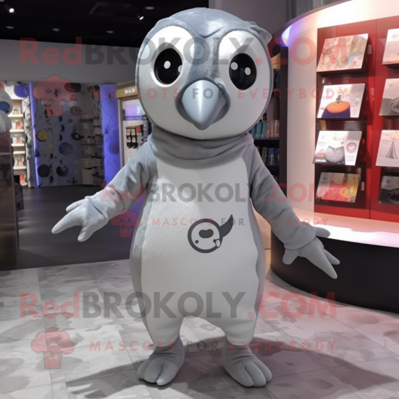 Silver Penguin mascot costume character dressed with a Playsuit and Earrings