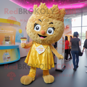 Gold Cupcake mascot costume character dressed with a Vest and Keychains