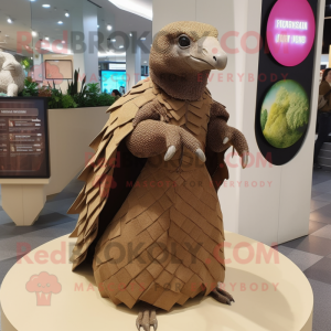 Brown Pangolin mascot costume character dressed with a Shift Dress and Shawl pins