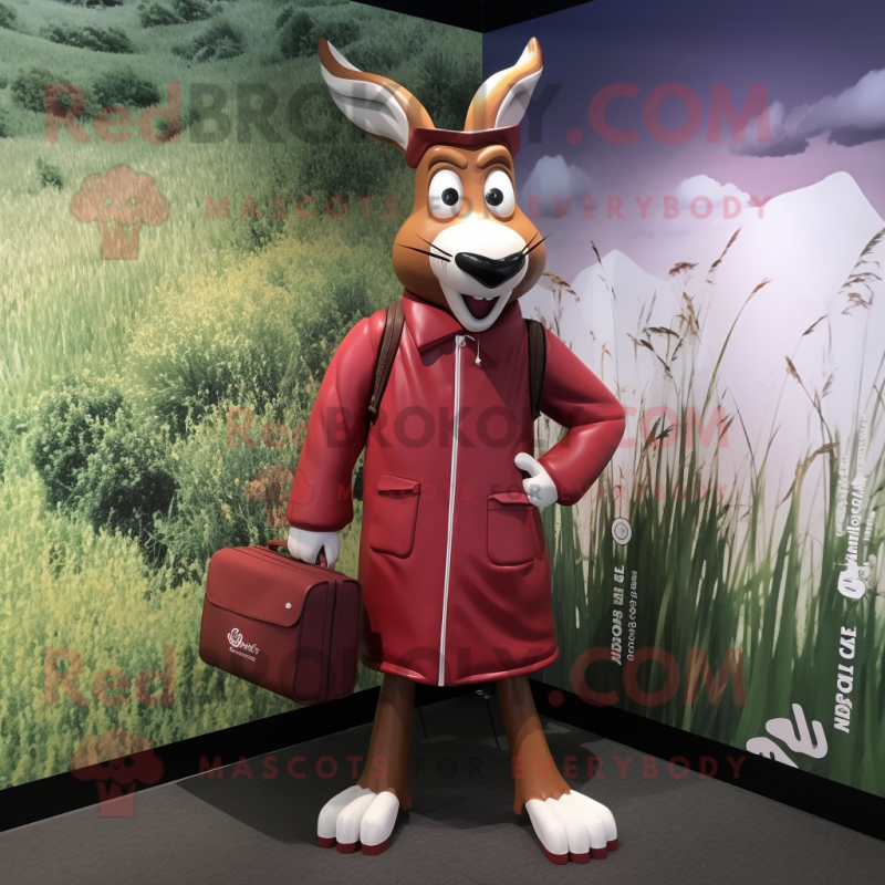 Maroon Gazelle mascot costume character dressed with a Raincoat and Briefcases Maroon Gazelle mascot costume character dressed with a Raincoat and Briefcases