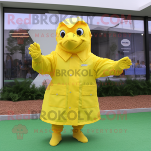 Lemon Yellow Turkey mascot costume character dressed with a Raincoat and Gloves