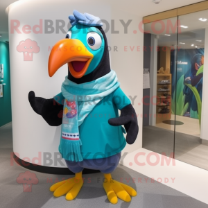 Turquoise Toucan mascot costume character dressed with a T-Shirt and Scarf clips