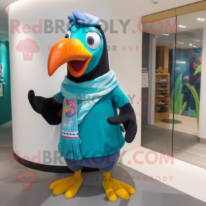 Turquoise Toucan mascot costume character dressed with a T-Shirt and Scarf clips