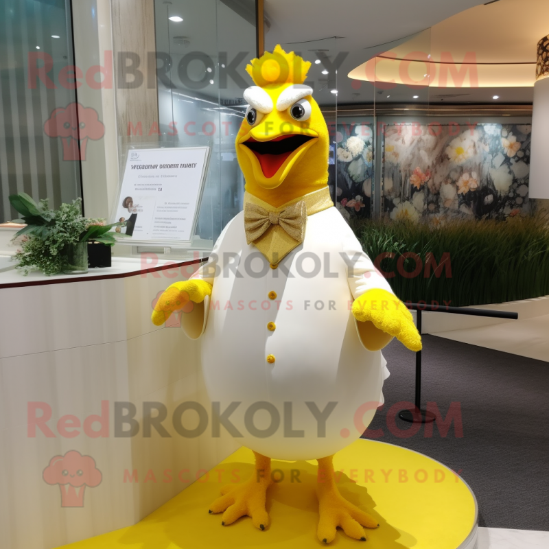 Yellow Quail mascot costume character dressed with a Wedding Dress and Cufflinks Yellow Quail mascot costume character dressed with a Wedding Dress and Cufflinks