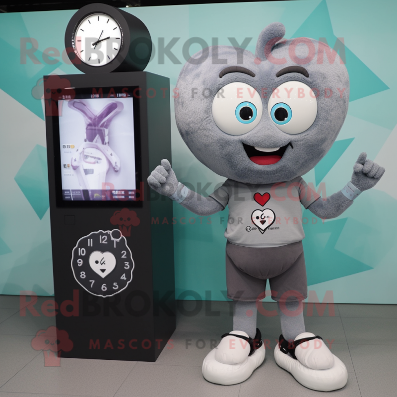 Gray Heart mascot costume character dressed with a T-Shirt and Digital watches Gray Heart mascot costume character dressed with a T-Shirt and Digital watches