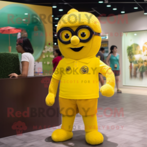 Yellow Raspberry mascot costume character dressed with a Polo Tee and Eyeglasses