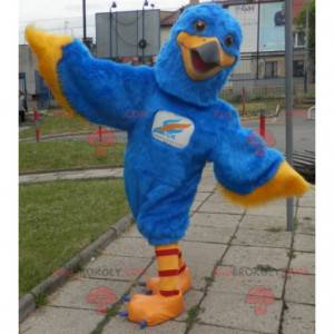 Blauwe en gele adelaar mascotte. Kleurrijke giermascotte -