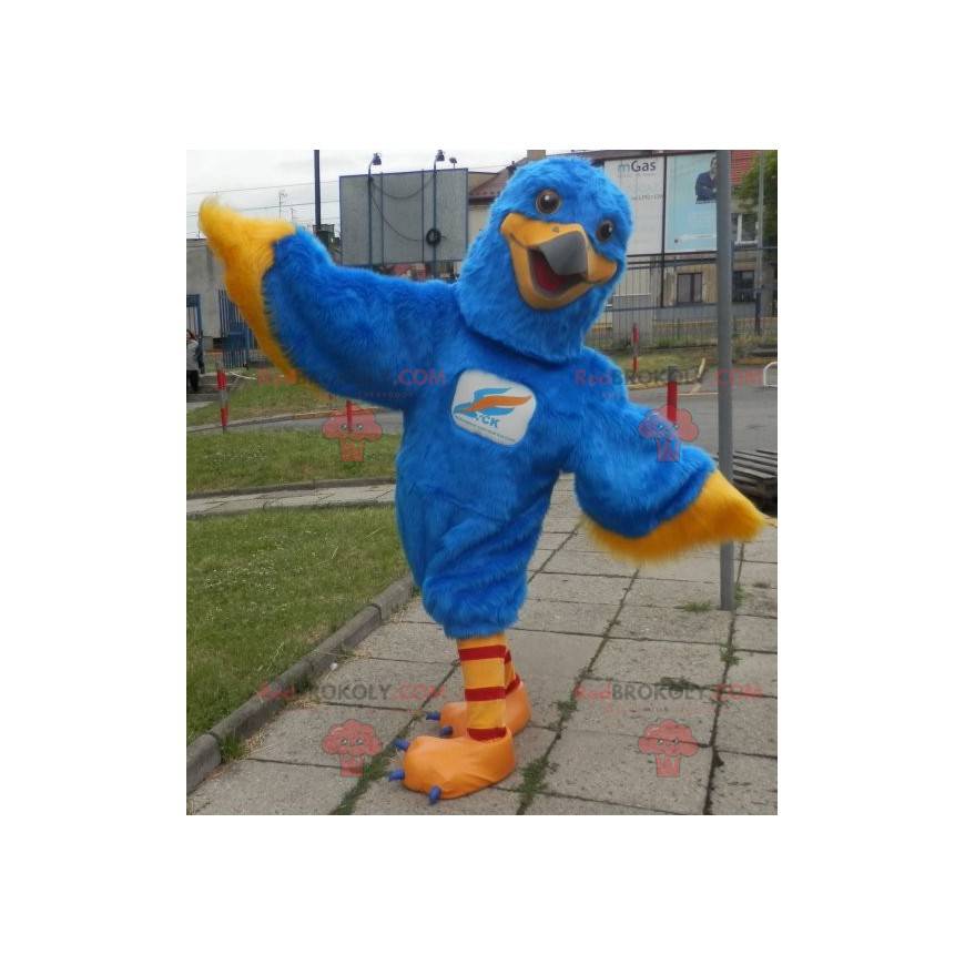 Blå og gul ørnemaskot. Farverig gribmascot - Redbrokoly.com