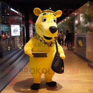 Gold Tapir mascot costume character dressed with a Trousers and Messenger bags