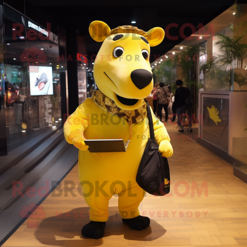 Gold Tapir mascot costume character dressed with a Trousers and Messenger bags Gold Tapir mascot costume character dressed with a Trousers and Messenger bags