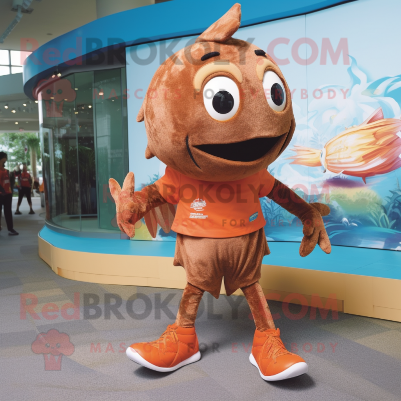 Brown Goldfish mascot costume character dressed with a Running Shorts and Shoe laces