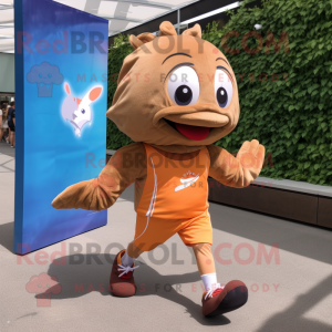 Brown Goldfish mascot costume character dressed with a Running Shorts and Shoe laces