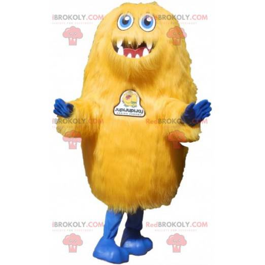 Haariges gelbes Kreaturenmaskottchen. Grizzly Maskottchen -