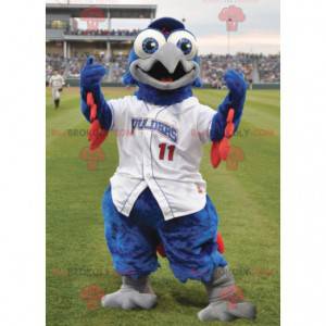 Mascotte d'oiseau bleu et rouge en tenue blanche -