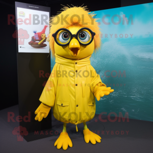 Yellow Betta Fish mascot costume character dressed with a Raincoat and Eyeglasses