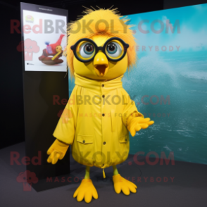 Yellow Betta Fish mascot costume character dressed with a Raincoat and Eyeglasses