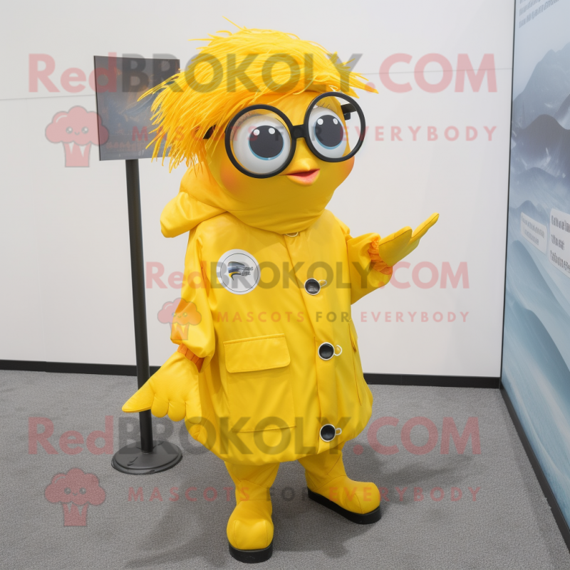 Yellow Betta Fish mascot costume character dressed with a Raincoat and Eyeglasses