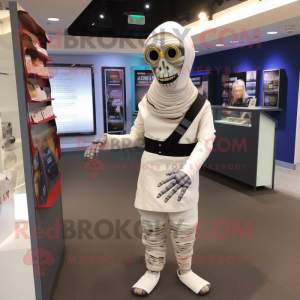 Navy Mummy mascot costume character dressed with a Suit Pants and Brooches