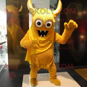 Gold Demon mascot costume character dressed with a Long Sleeve Tee and Scarf clips