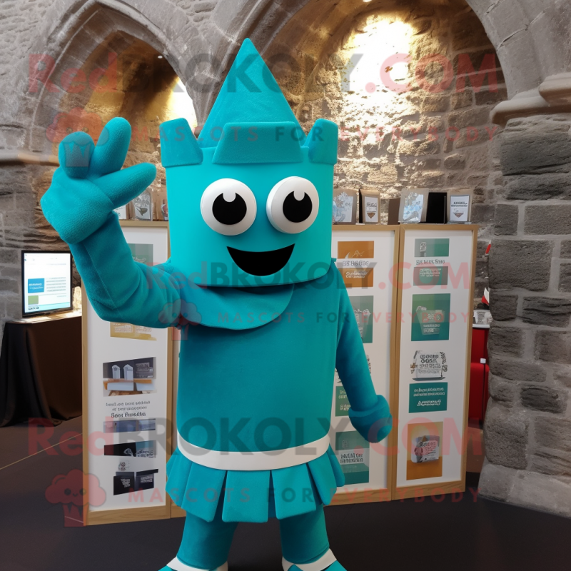 Turquoise Irish Castle mascot costume character dressed with a V-Neck Tee and Gloves Turquoise Irish Castle mascot costume character dressed with a V-Neck Tee and Gloves
