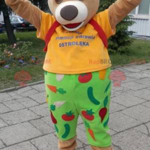 Beige bear mascot dressed in yellow and green - Redbrokoly.com