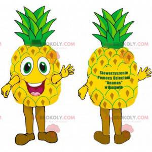 Mascotte d'ananas jaune et vert géant très souriant. -