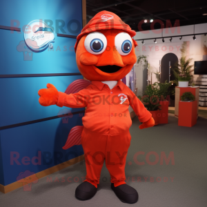 Red Goldfish mascot costume character dressed with a Polo Tee and Tie pins