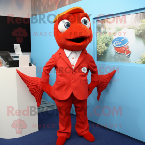 Red Goldfish mascot costume character dressed with a Polo Tee and Tie pins