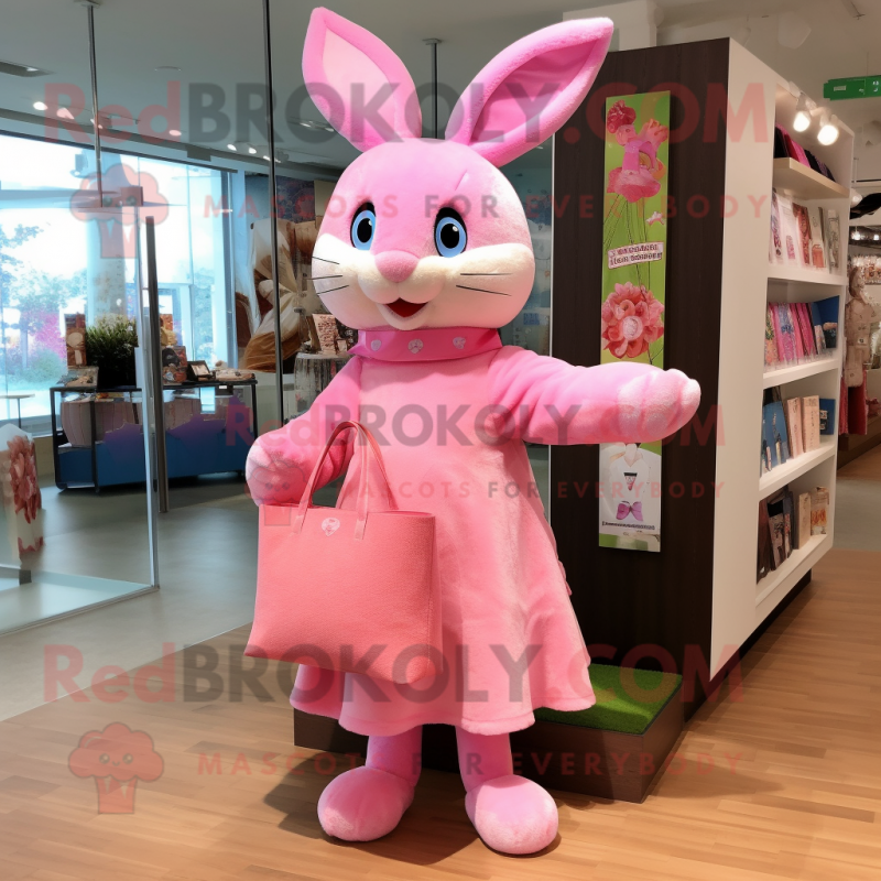 Pink Rabbit mascot costume character dressed with a Wrap Dress and Tote bags