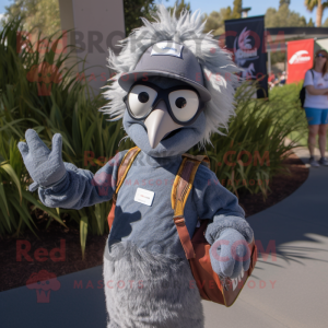 Gray Emu mascot costume character dressed with a Flare Jeans and Messenger bags