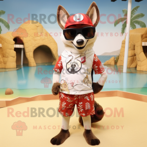 Cream Dingo mascot costume character dressed with a Swimwear and Sunglasses