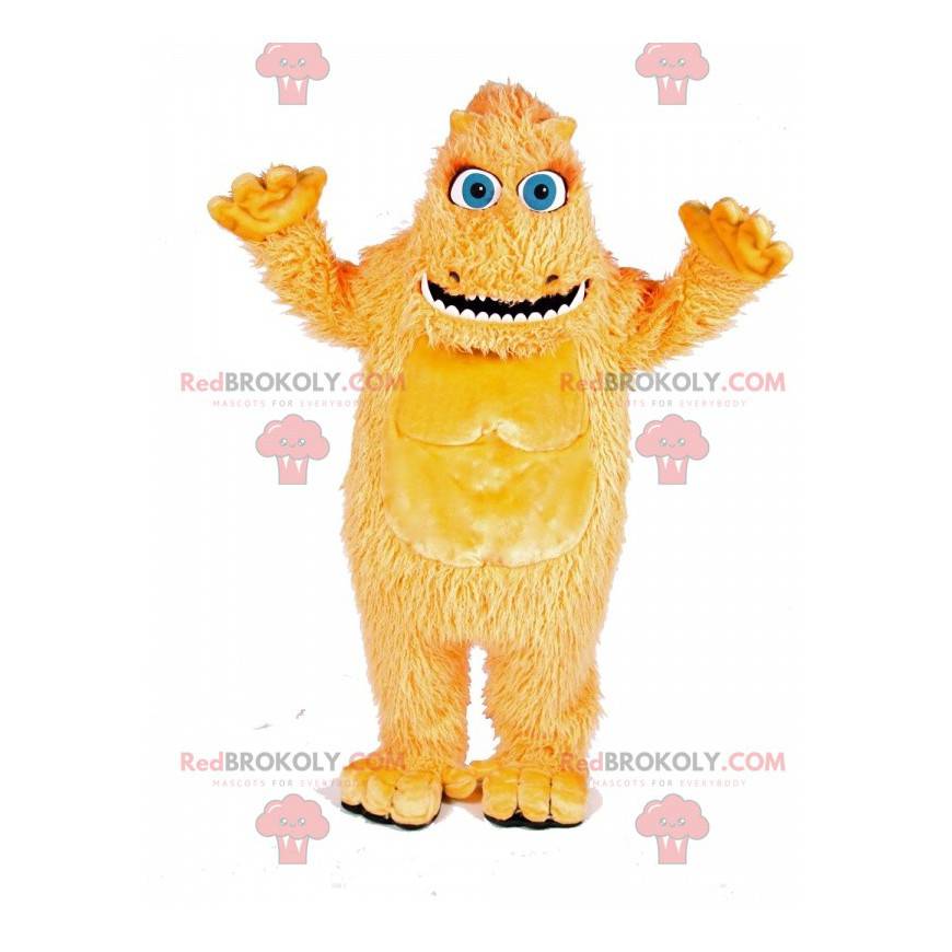 Mascote monstro peludo amarelo com grandes olhos azuis -
