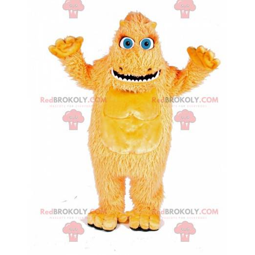 Mascote monstro peludo amarelo com grandes olhos azuis -