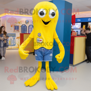 Yellow Squid mascot costume character dressed with a Denim Shorts and Brooches