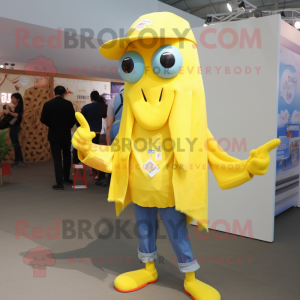 Yellow Squid mascot costume character dressed with a Denim Shorts and Brooches