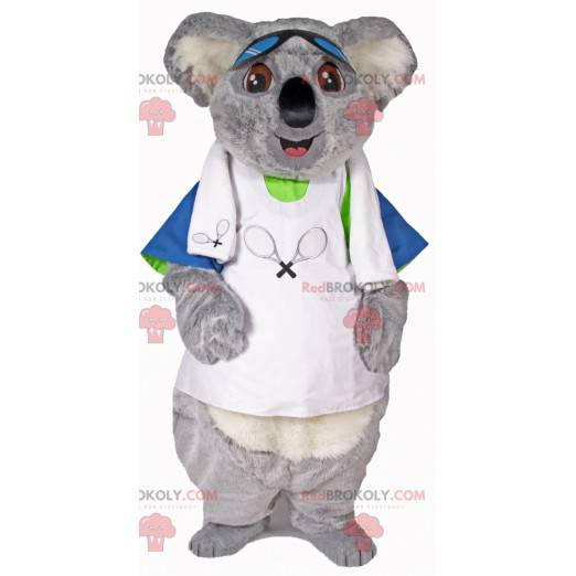 Mascotte koala grigio e bianco in abbigliamento da tennis -
