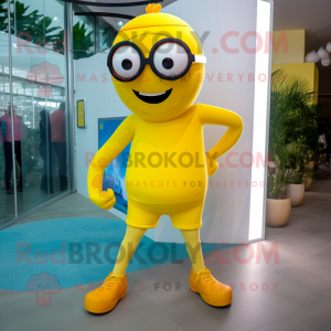 Yellow Cyclops mascot costume character dressed with a Capri Pants and Eyeglasses